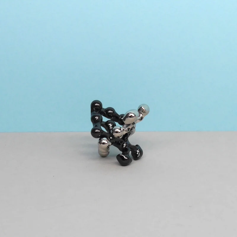 HUZZLE CAST DOT - elegantes Logikpuzzle
